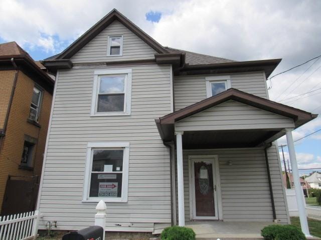 view of front of house featuring fence