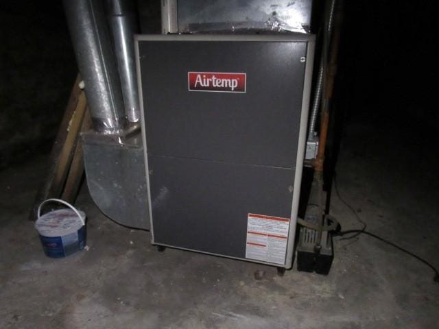 utility room with heating unit