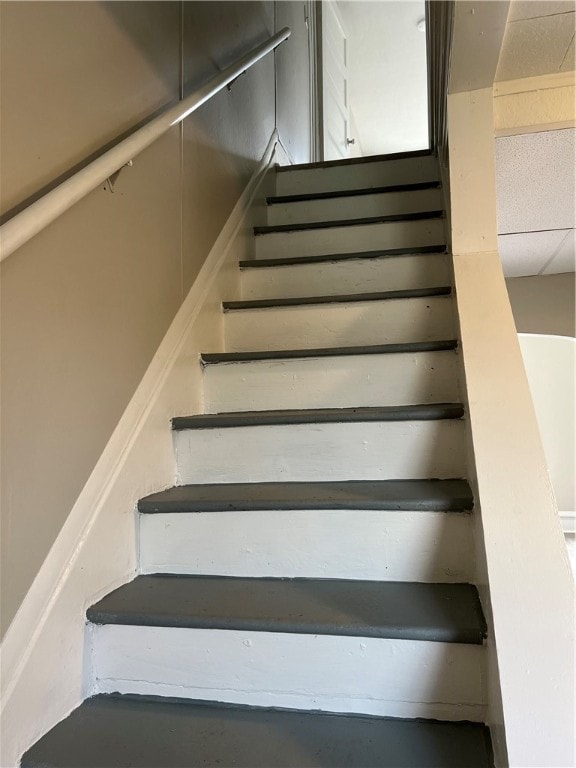 staircase with a drop ceiling