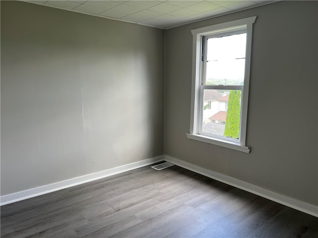 unfurnished room featuring hardwood / wood-style floors