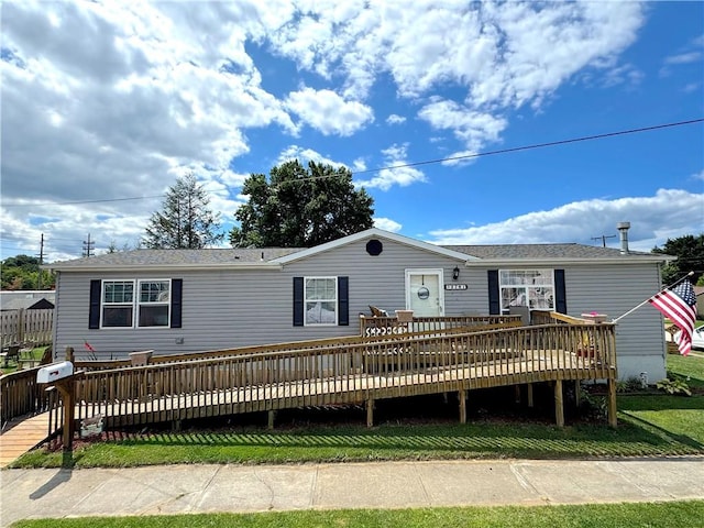 view of front of house with a wooden deck