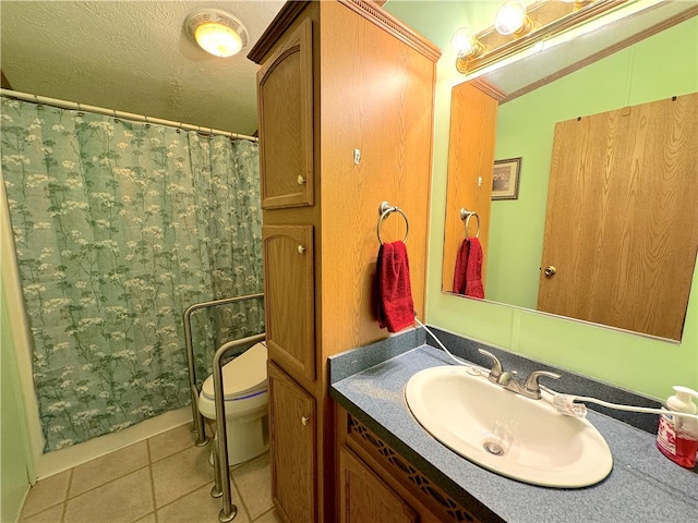 bathroom featuring vanity, toilet, a textured ceiling, and tile patterned flooring