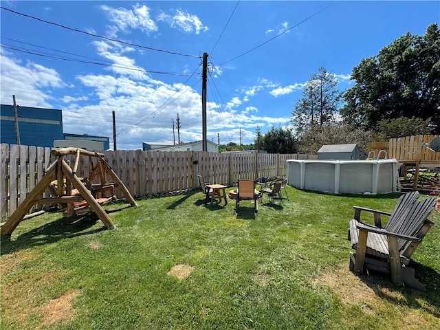 view of yard featuring a fenced backyard and a fenced in pool