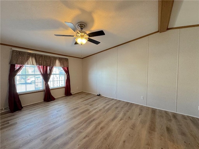 unfurnished room with a ceiling fan, light wood-style flooring, ornamental molding, and a textured ceiling