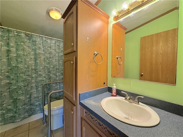 bathroom with toilet, vanity, a shower with shower curtain, and tile patterned floors