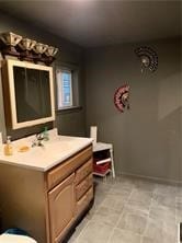 bathroom with tile patterned floors and vanity