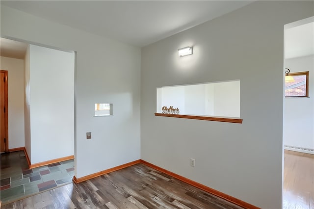 empty room with hardwood / wood-style flooring