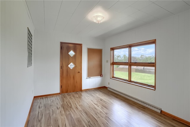 entryway with light wood-type flooring and a baseboard radiator