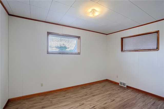 empty room with light hardwood / wood-style floors