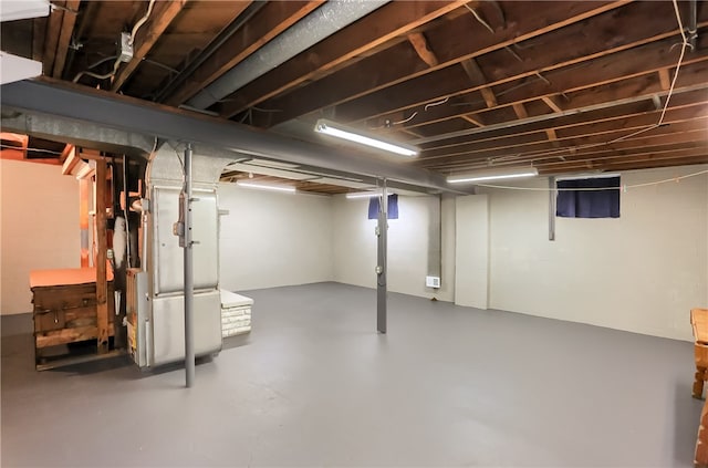 basement featuring heating unit