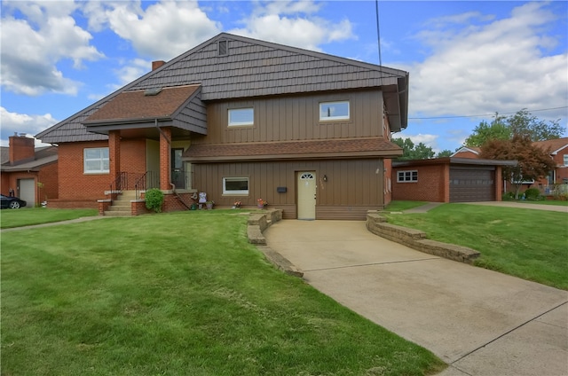 view of front of house with a garage and a front yard