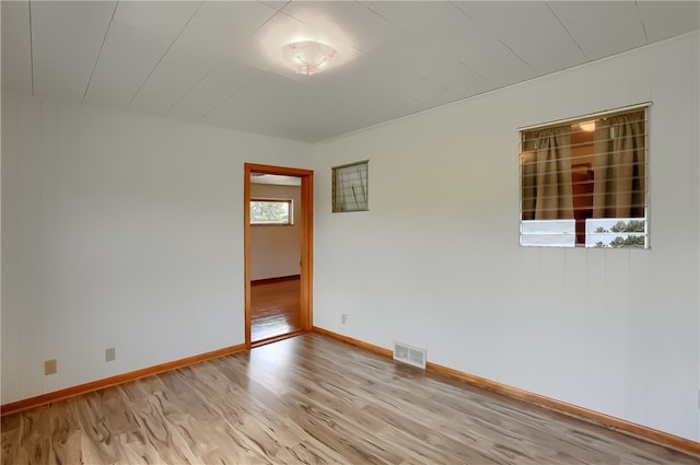 spare room featuring light hardwood / wood-style floors