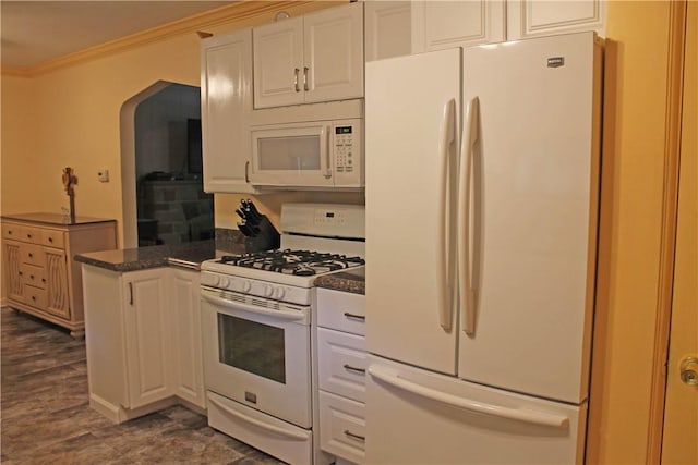 kitchen featuring white appliances, arched walkways, white cabinets, and crown molding