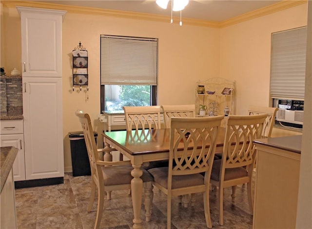 dining space featuring ceiling fan and ornamental molding