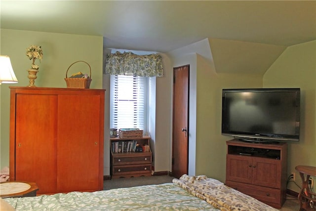 bedroom with carpet floors and baseboards