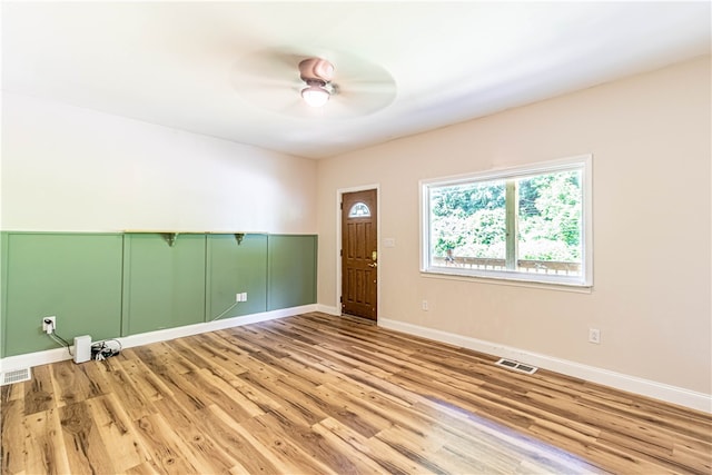 interior space with ceiling fan and light hardwood / wood-style flooring