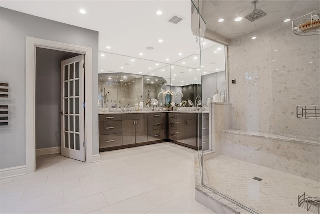 bathroom with vanity, walk in shower, and tile patterned floors