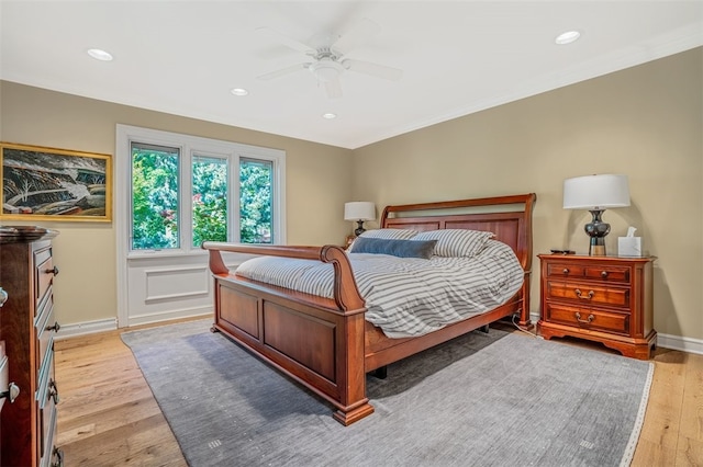 bedroom with ceiling fan and light hardwood / wood-style flooring