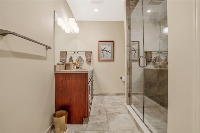 bathroom with tile patterned flooring, a shower with door, and vanity