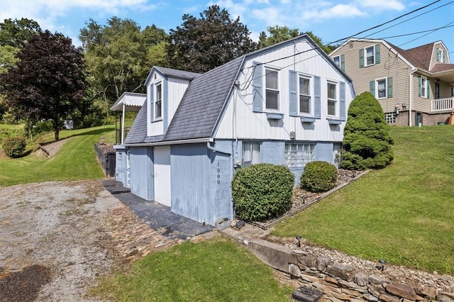 view of home's exterior featuring a lawn