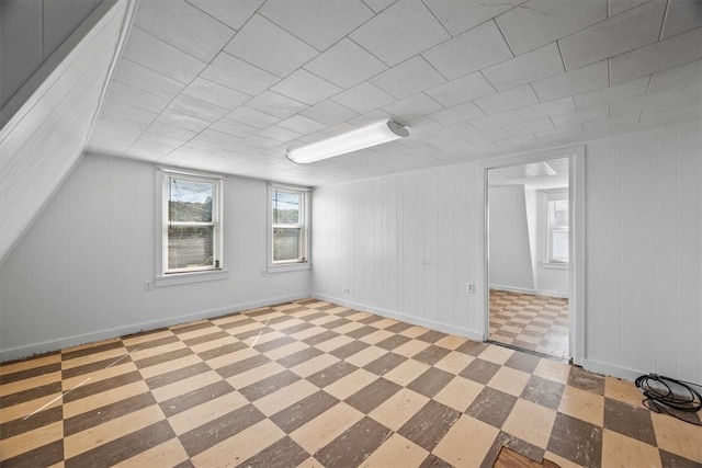 additional living space with plenty of natural light and light tile patterned floors