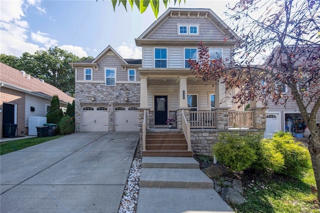 craftsman-style home with a garage and covered porch