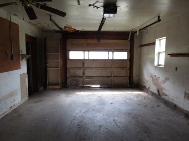 garage with ceiling fan and a garage door opener