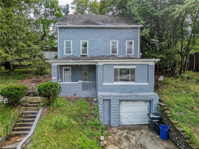 view of front of home featuring a garage and covered porch