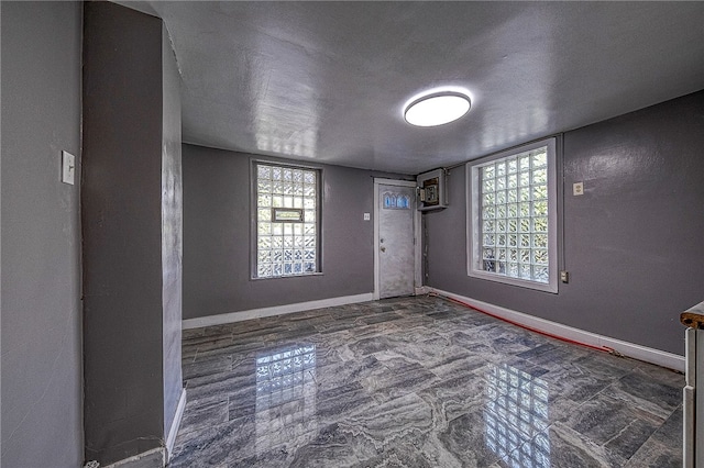 entrance foyer featuring tile patterned flooring and a textured ceiling