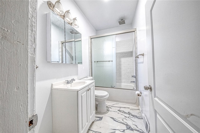 full bathroom featuring tile patterned floors, toilet, vanity, and bath / shower combo with glass door