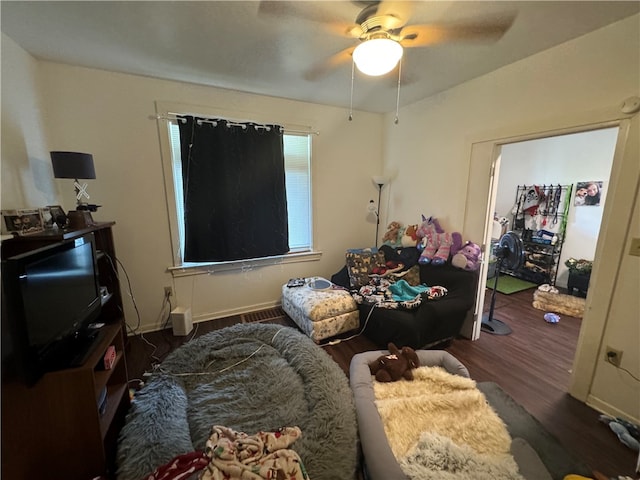 interior space featuring ceiling fan and dark wood-type flooring