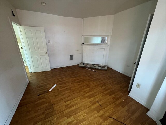 175 Penn Ave, Mount Oliver, PA 15210 - unfurnished living room featuring visible vents and wood finished floors