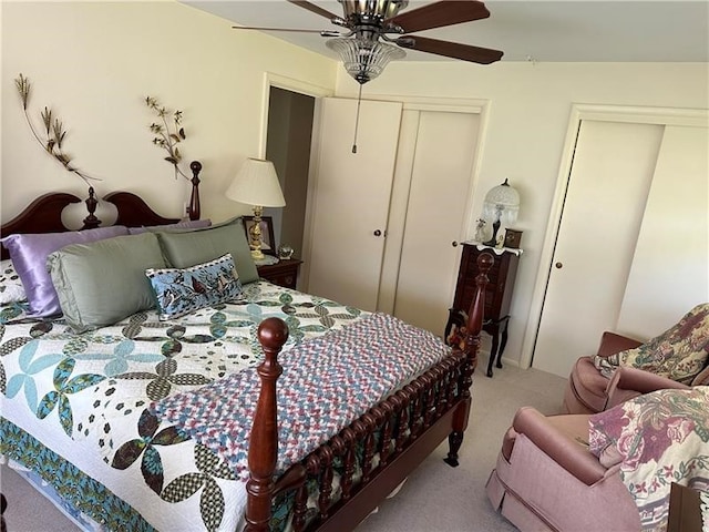 bedroom with ceiling fan and light carpet