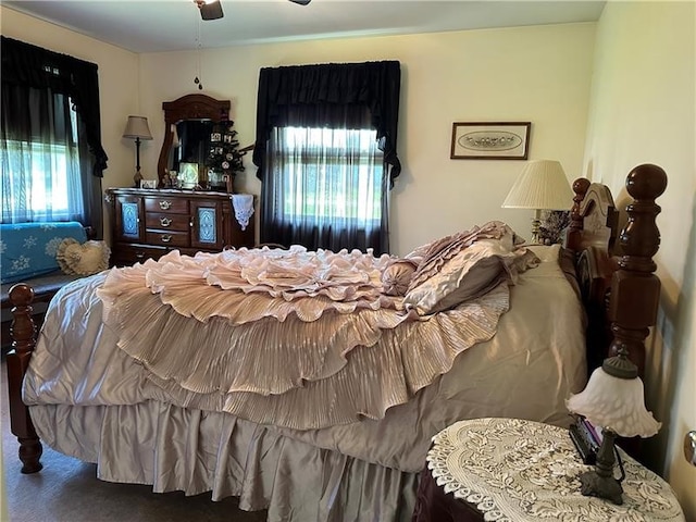 carpeted bedroom featuring ceiling fan