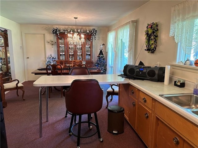 carpeted dining area featuring an inviting chandelier