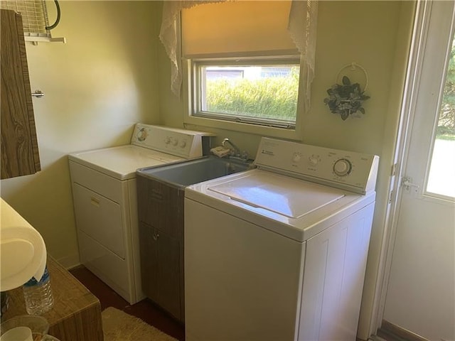 washroom with separate washer and dryer and plenty of natural light