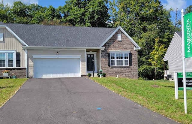 view of front facade with a front lawn and a garage