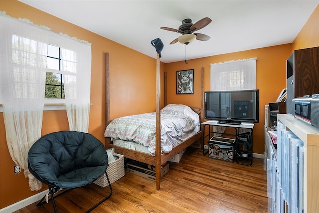 bedroom featuring ceiling fan and light hardwood / wood-style flooring