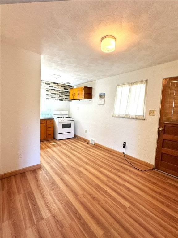 unfurnished living room featuring light wood-type flooring