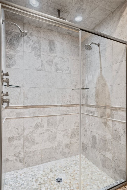 bathroom featuring an enclosed shower