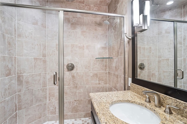 bathroom with vanity and walk in shower