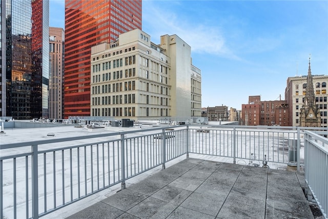 view of patio featuring a balcony