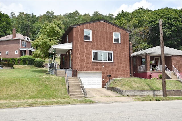 view of front of house featuring a garage and a front yard