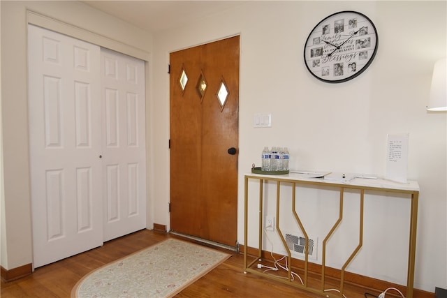 foyer entrance with hardwood / wood-style flooring