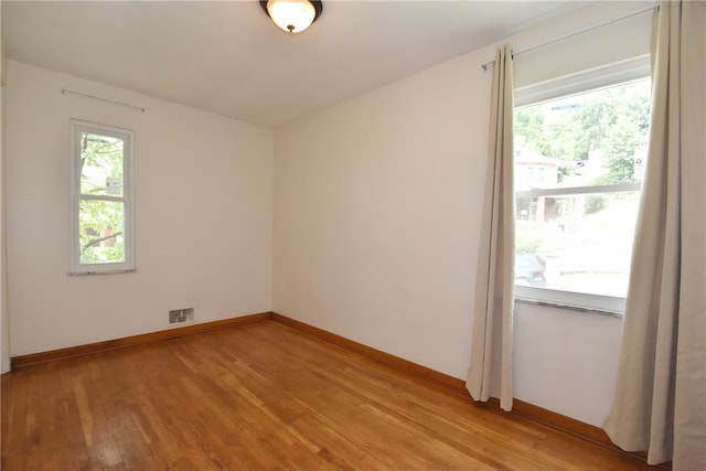 unfurnished room featuring light hardwood / wood-style flooring