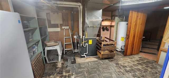 basement featuring gas water heater and white fridge