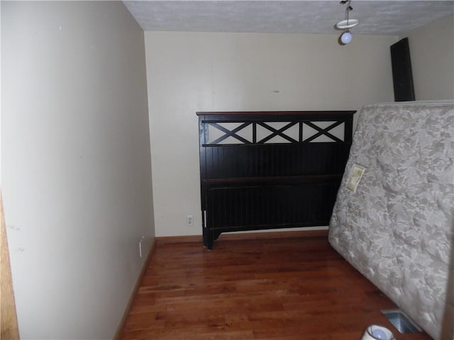 empty room featuring dark hardwood / wood-style flooring