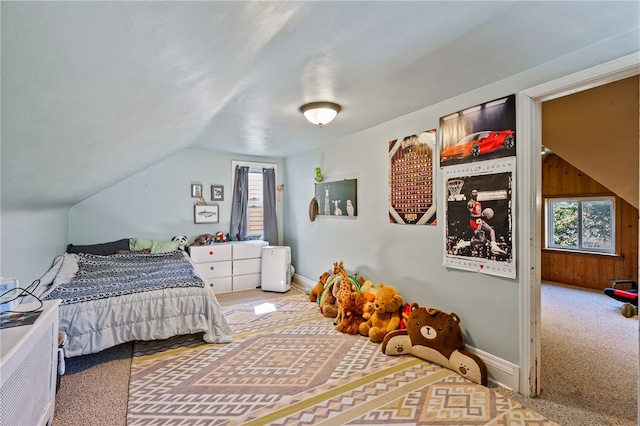 carpeted bedroom featuring lofted ceiling