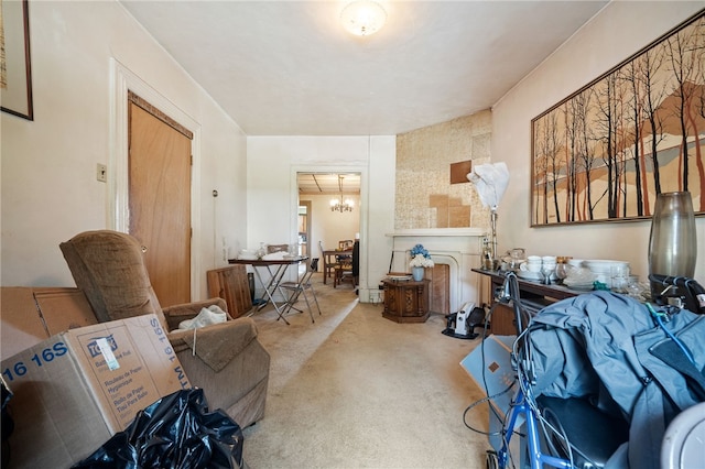 living room featuring a notable chandelier and carpet