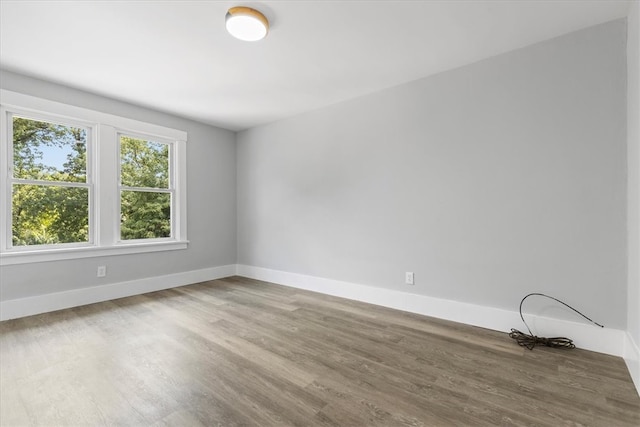 unfurnished room featuring hardwood / wood-style floors